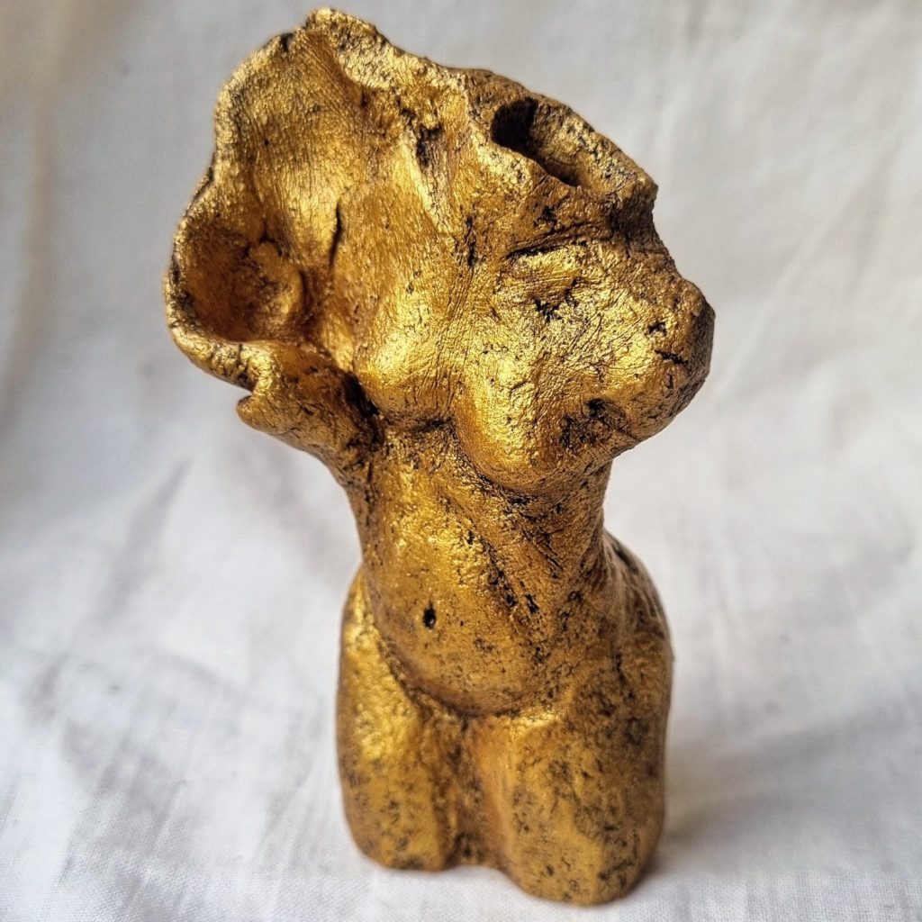 Small Gold bronze nude female sculpture on linen backdrop. Karen Wilde New Zealand Contemporary Ceramic Sculpture Artist