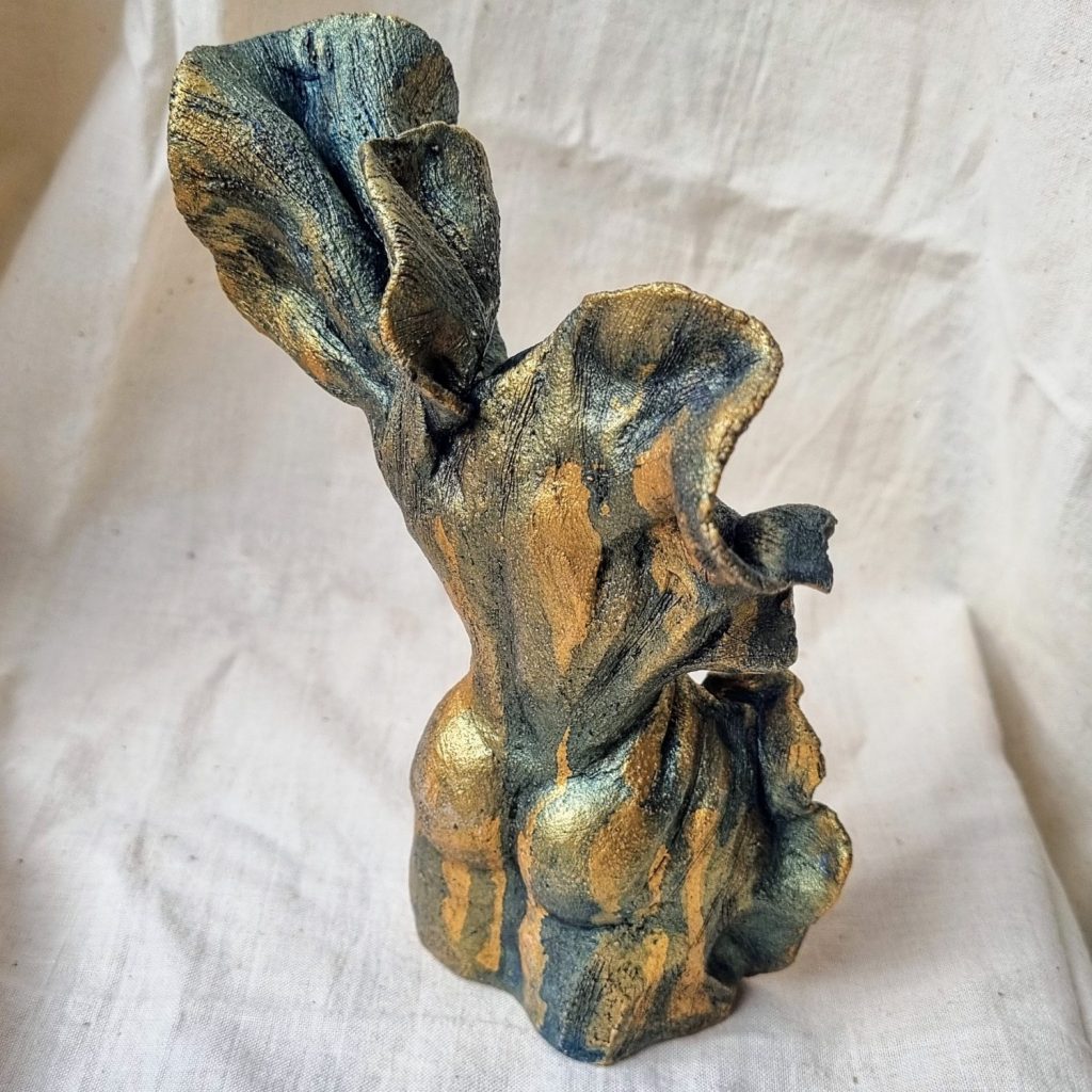 Back view of gold with blue drips female abstract nude sculpture by Karen Wilde New Zealand Contemporary Ceramic Sculpture Artist